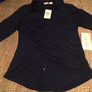 Navy blue, 3/4 length sleeve shirt. Never worn.